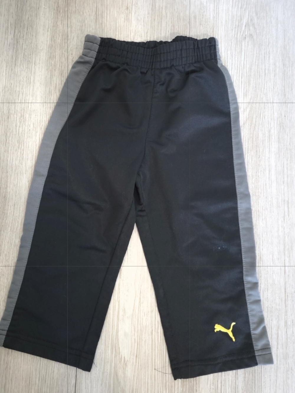Puma Black Joggers with Gray Side Stripes and Yellow Logo